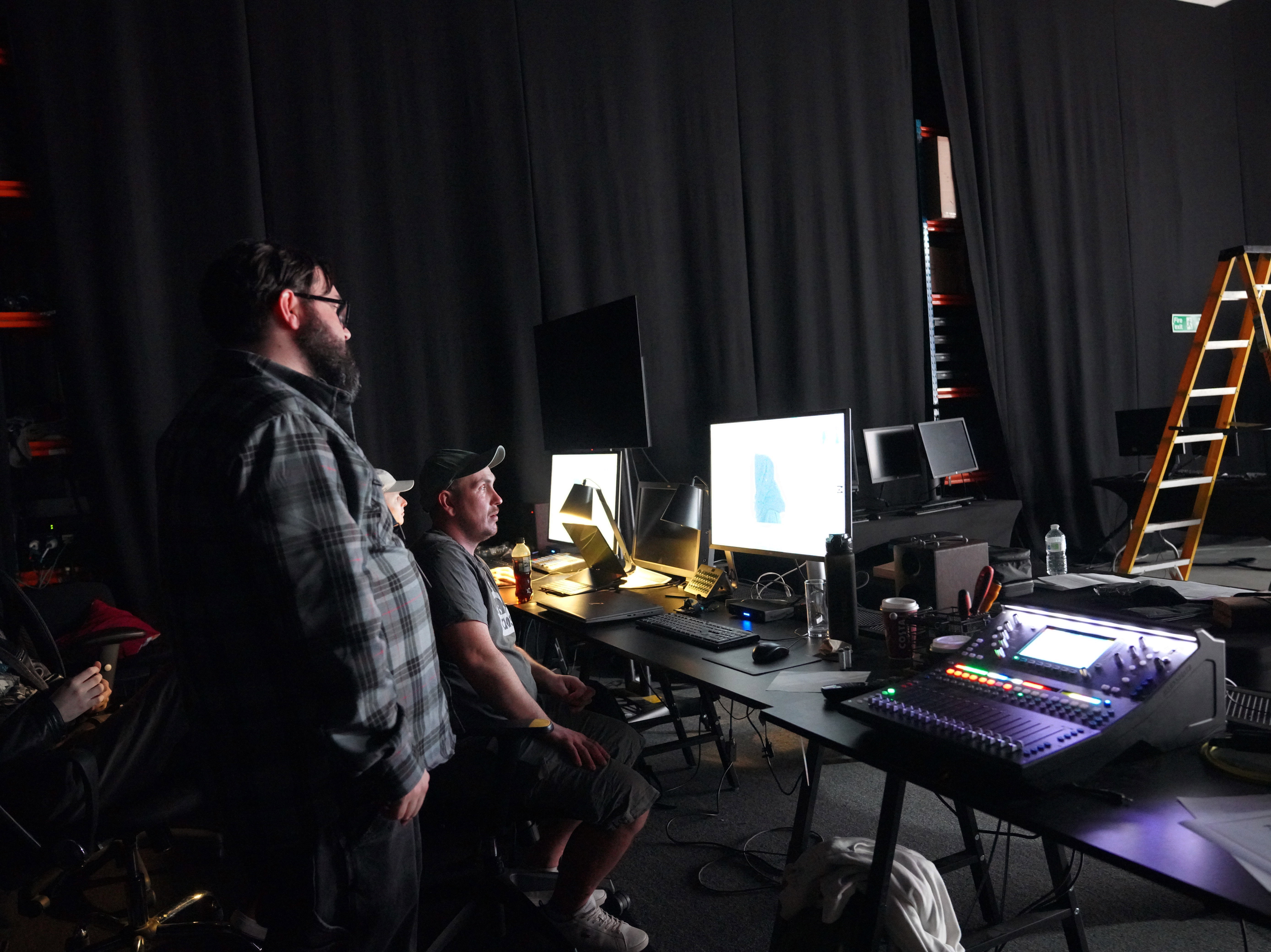 Students looking at screens in the virtual production studio